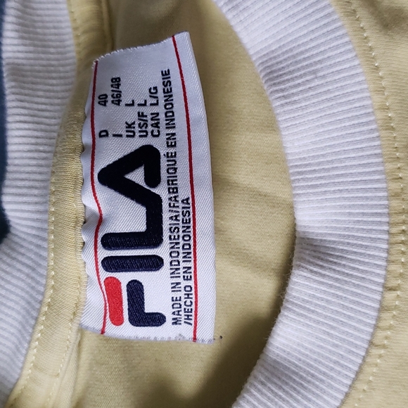 Large Fila cropped shirt w/ no holes or stains. Looks new. Only worn a few times - Picture 2 of 3
